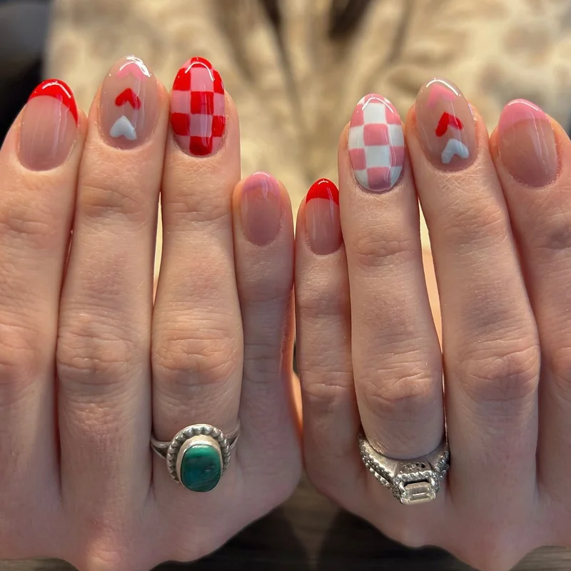 Pattern mixing Valentine nail art with hearts lace and French tips in coordinated palette