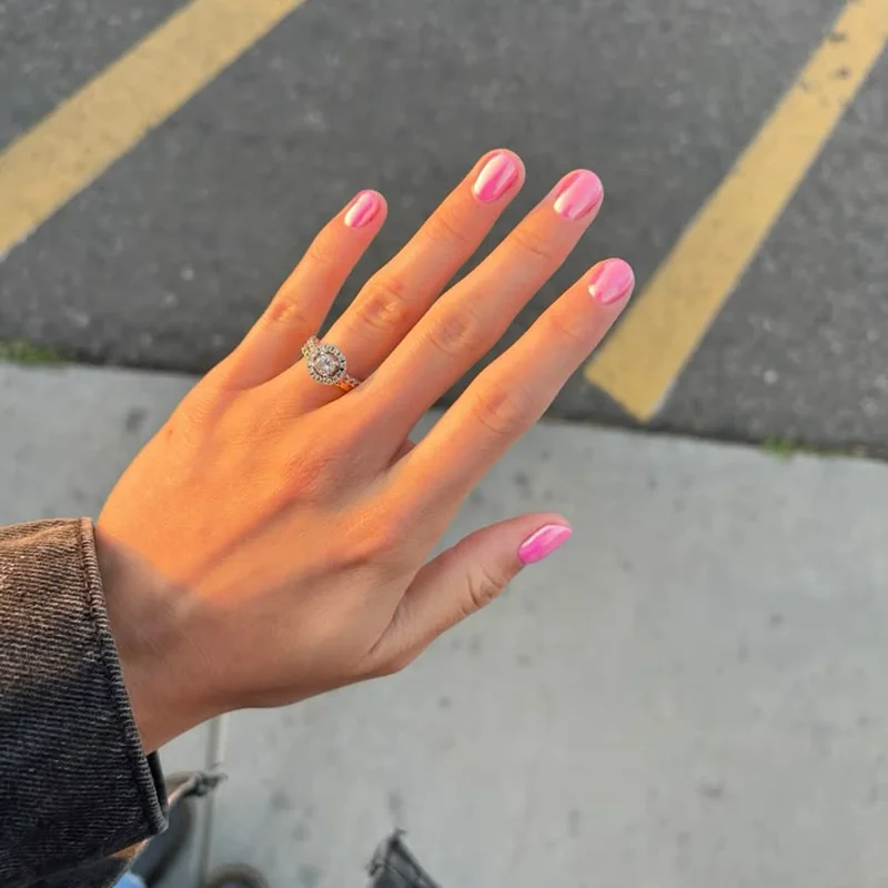 Chrome powder burnishing technique showing silicone applicator creating mirror finish on red base
