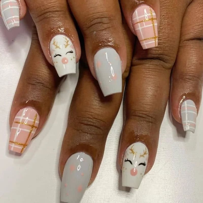 Christmas character nails combined with snowflakes and candy cane stripe patterns