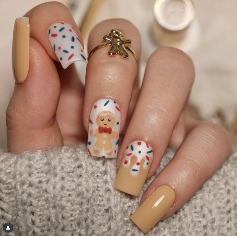 Santa, Rudolph reindeer, and gingerbread man character nail art designs for Christmas 2025 holiday manicure