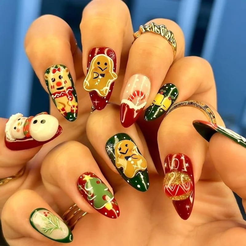 Mix and match Christmas nail set featuring Santa on ring finger, Rudolph on middle finger, coordinated with red polish