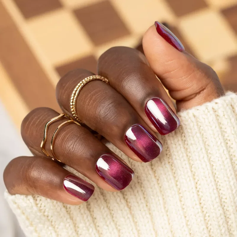 short natural nails being prepped with buffing block and base coat application tutorial steps