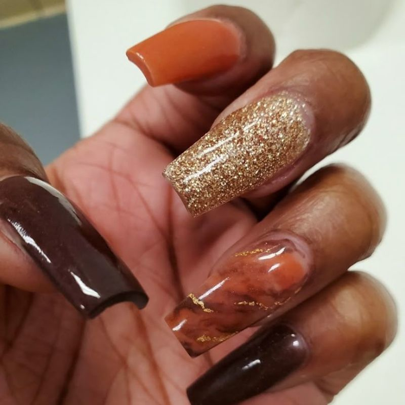 Best thanksgiving nail colors including burgundy burnt orange and gold polish swatches