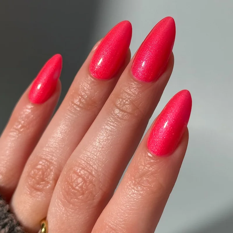 Tomato red nail polish swatches on warm medium and olive skin tones demonstrating flattering effect