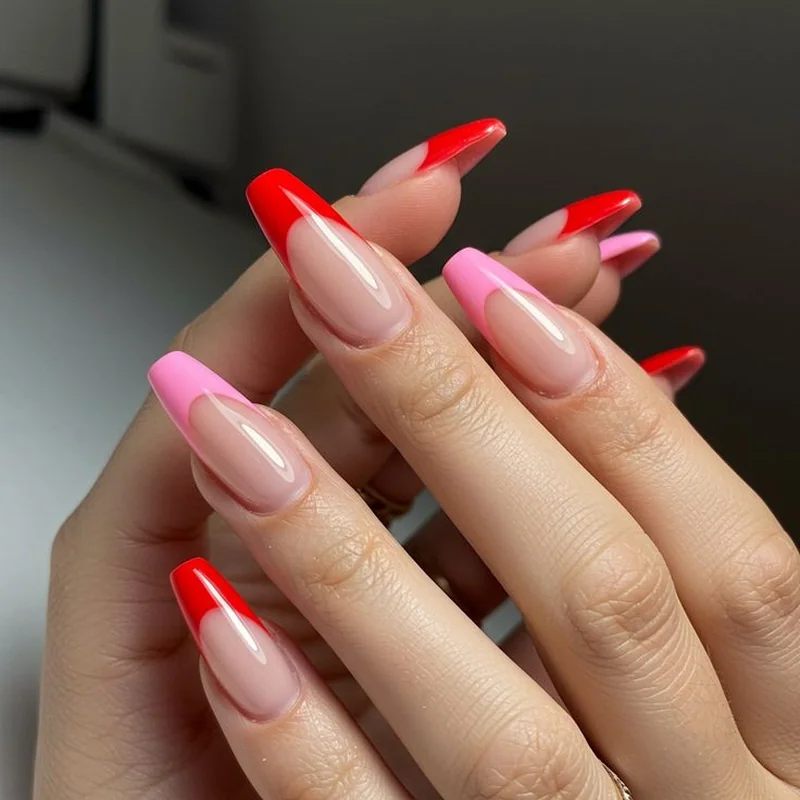 Classic red French tips replacing traditional white with bold valentine color