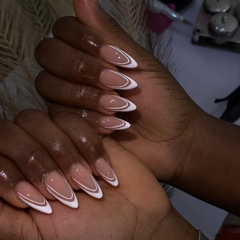 Double French tips showing two-tone layered valentine nail precision