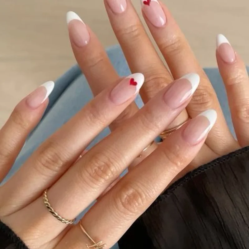 Heart-shaped French tips with romantic curved tip geometry