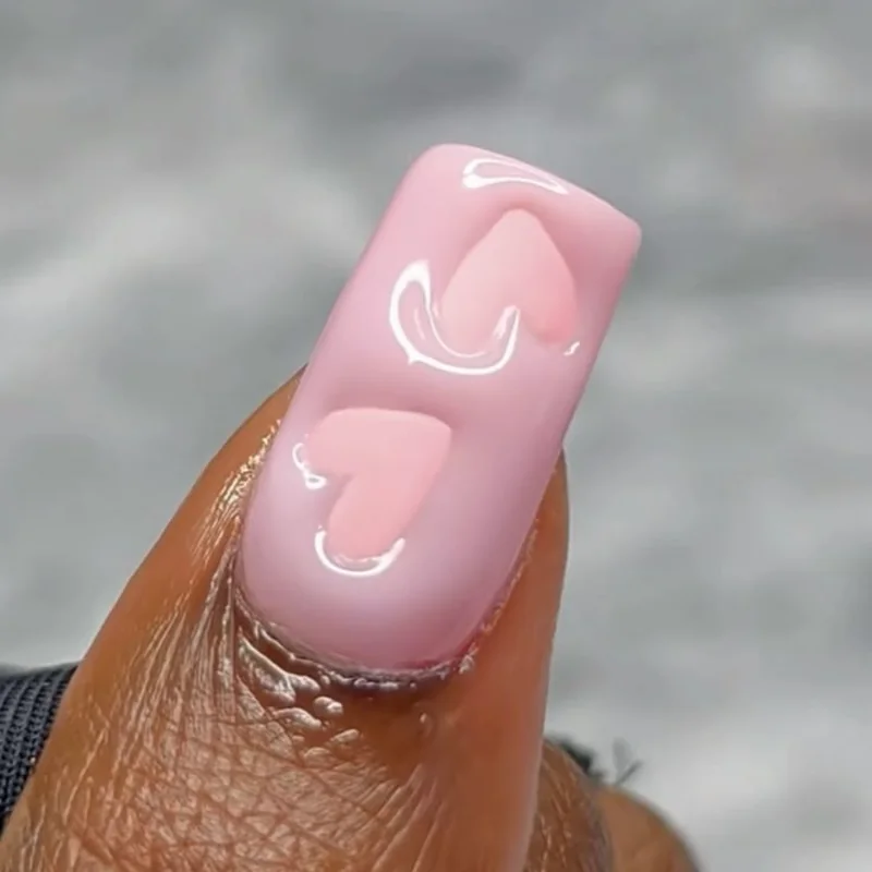 3D heart Valentine nails with chrome embellishments