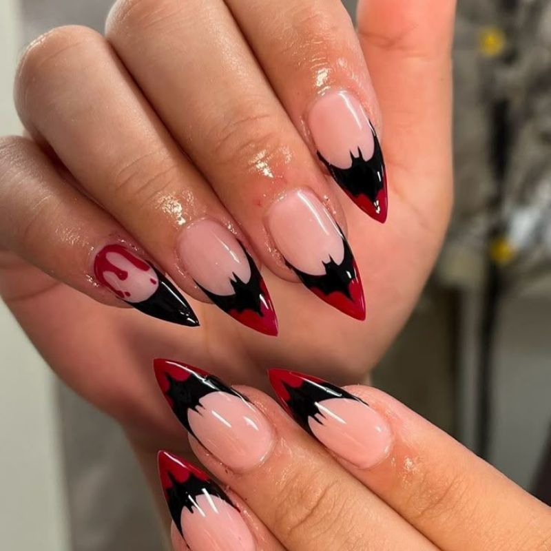 Short almond vampire nails with blood red manicure