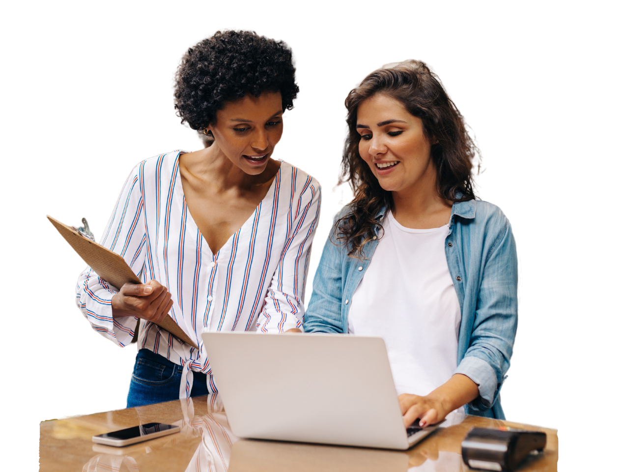Women talking in front of laptop