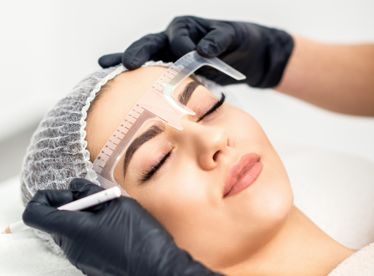 Client receiving brow treatment