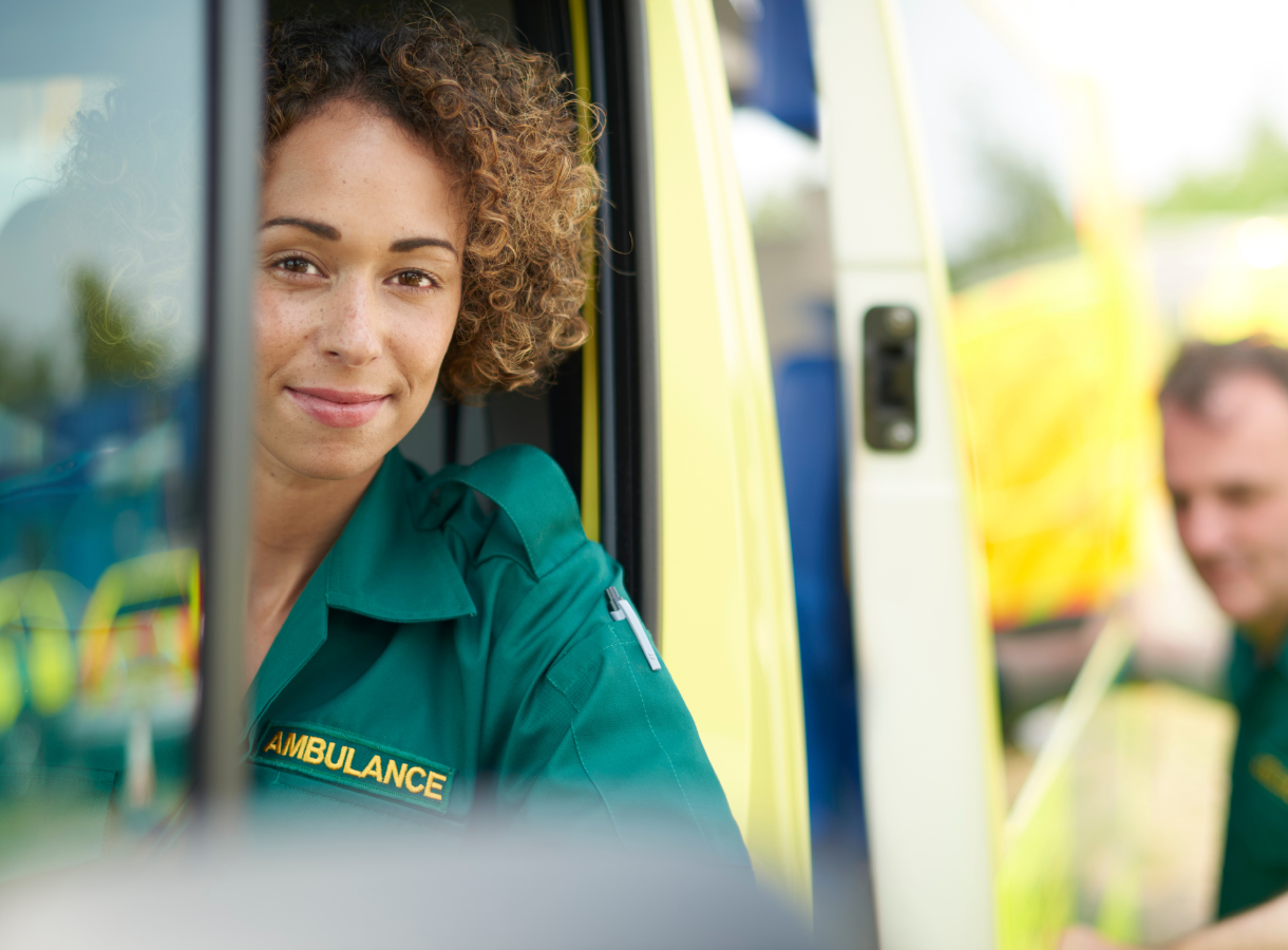 Female paramedic looking at camera
