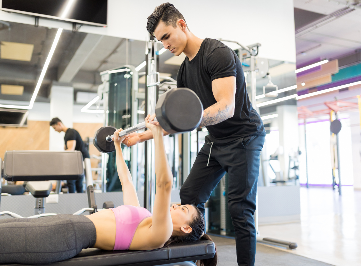 Male personal trainer with client