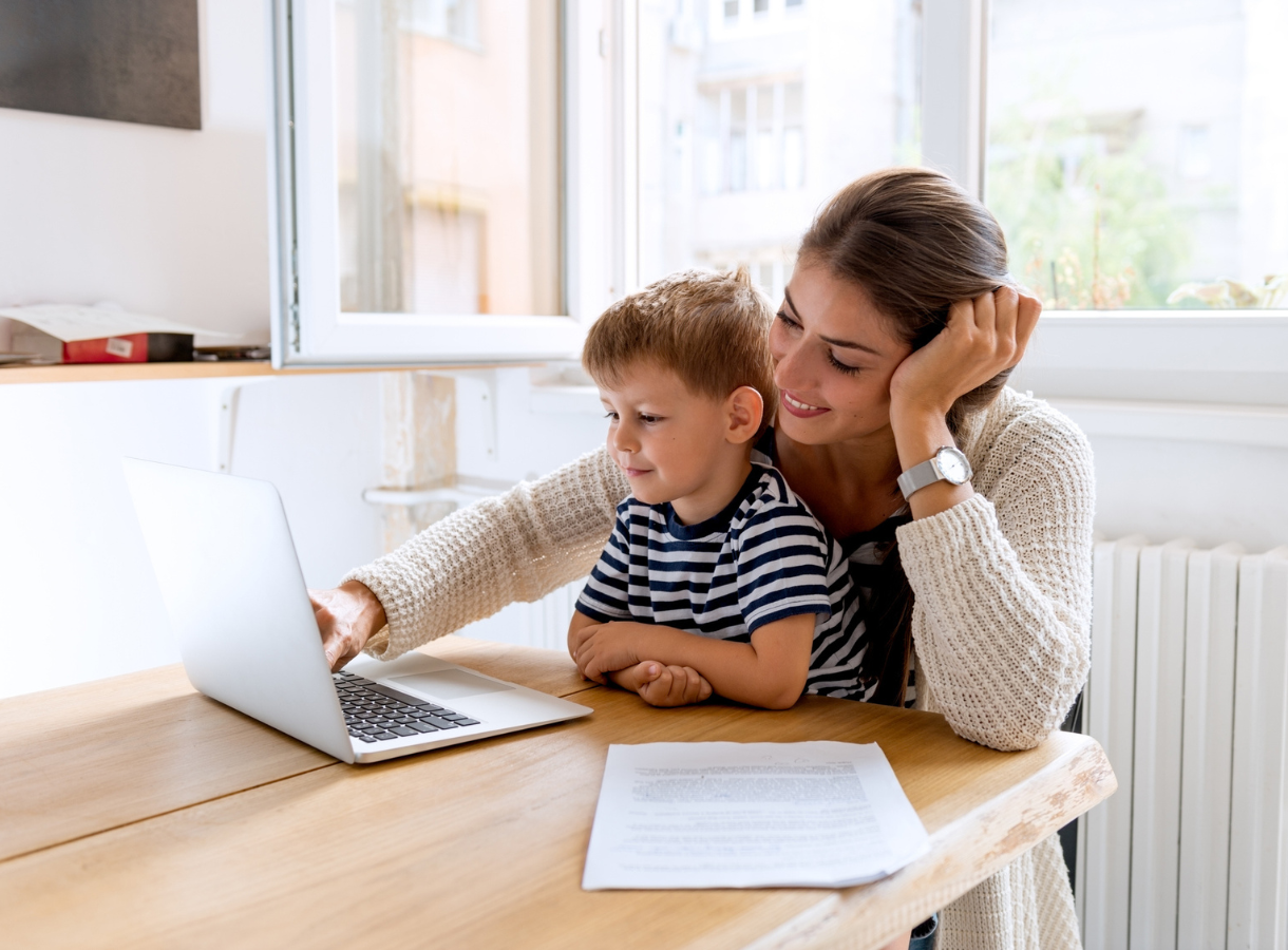 Woman and child on laptop
