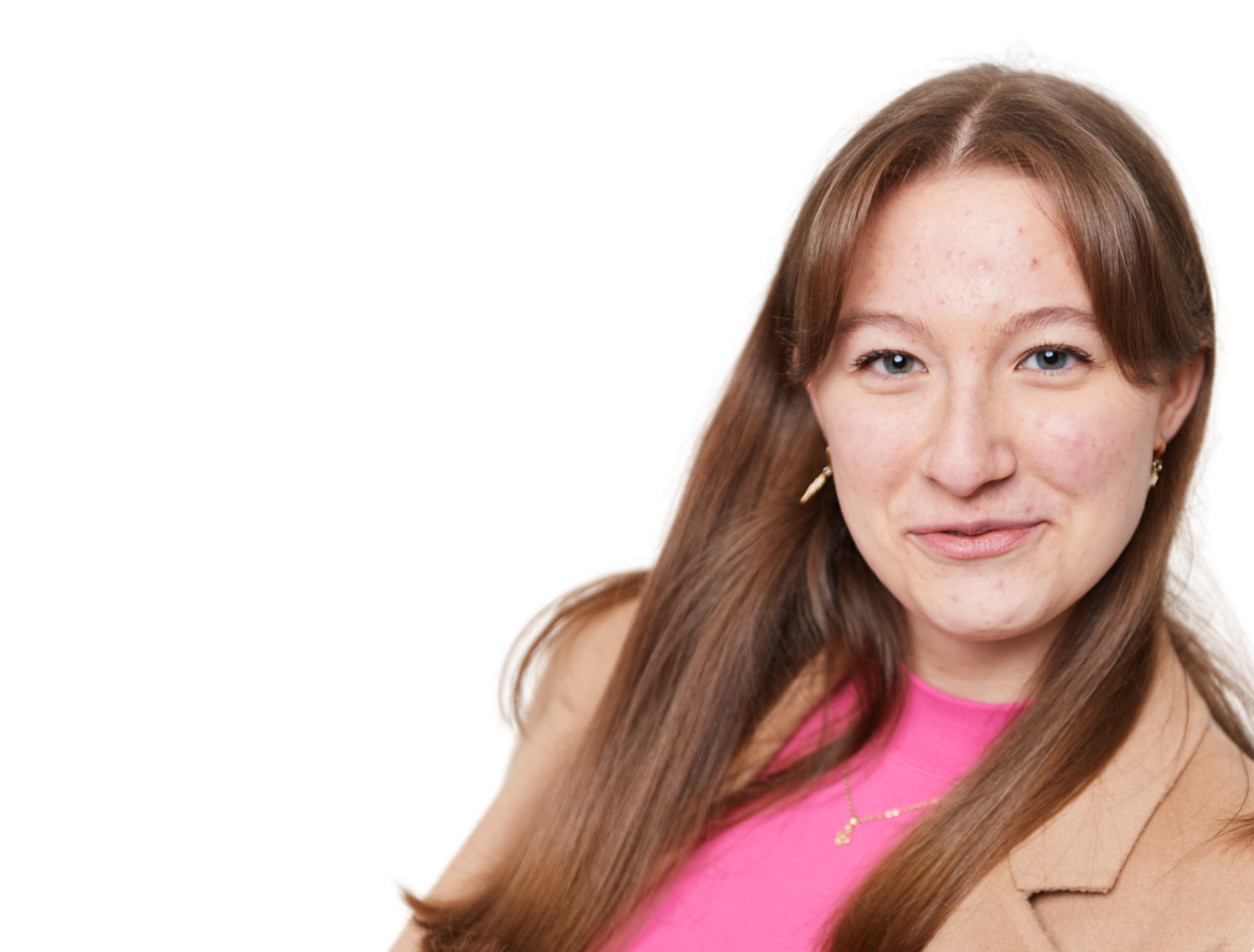 girl wearing blazer looking at the camera smiling