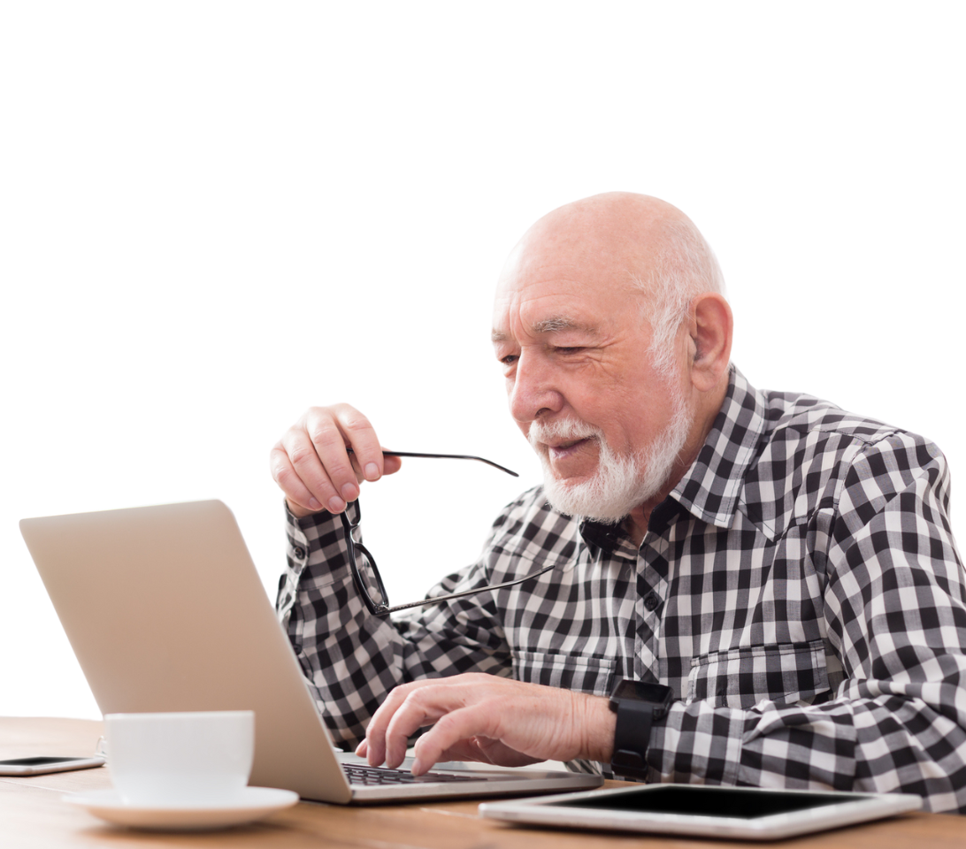 retiree studying on a laptop