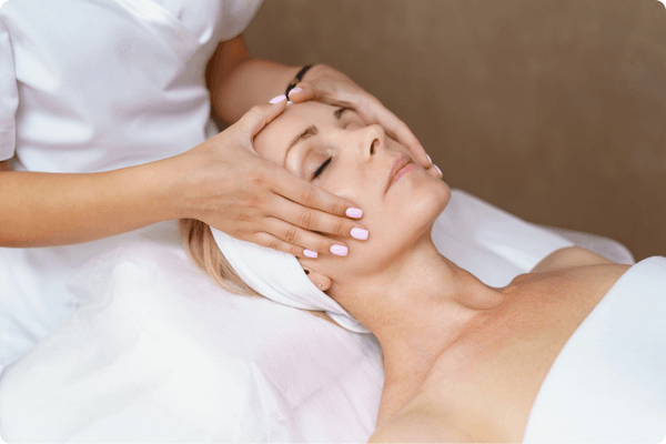 Client receiving holistic beauty therapy treatment