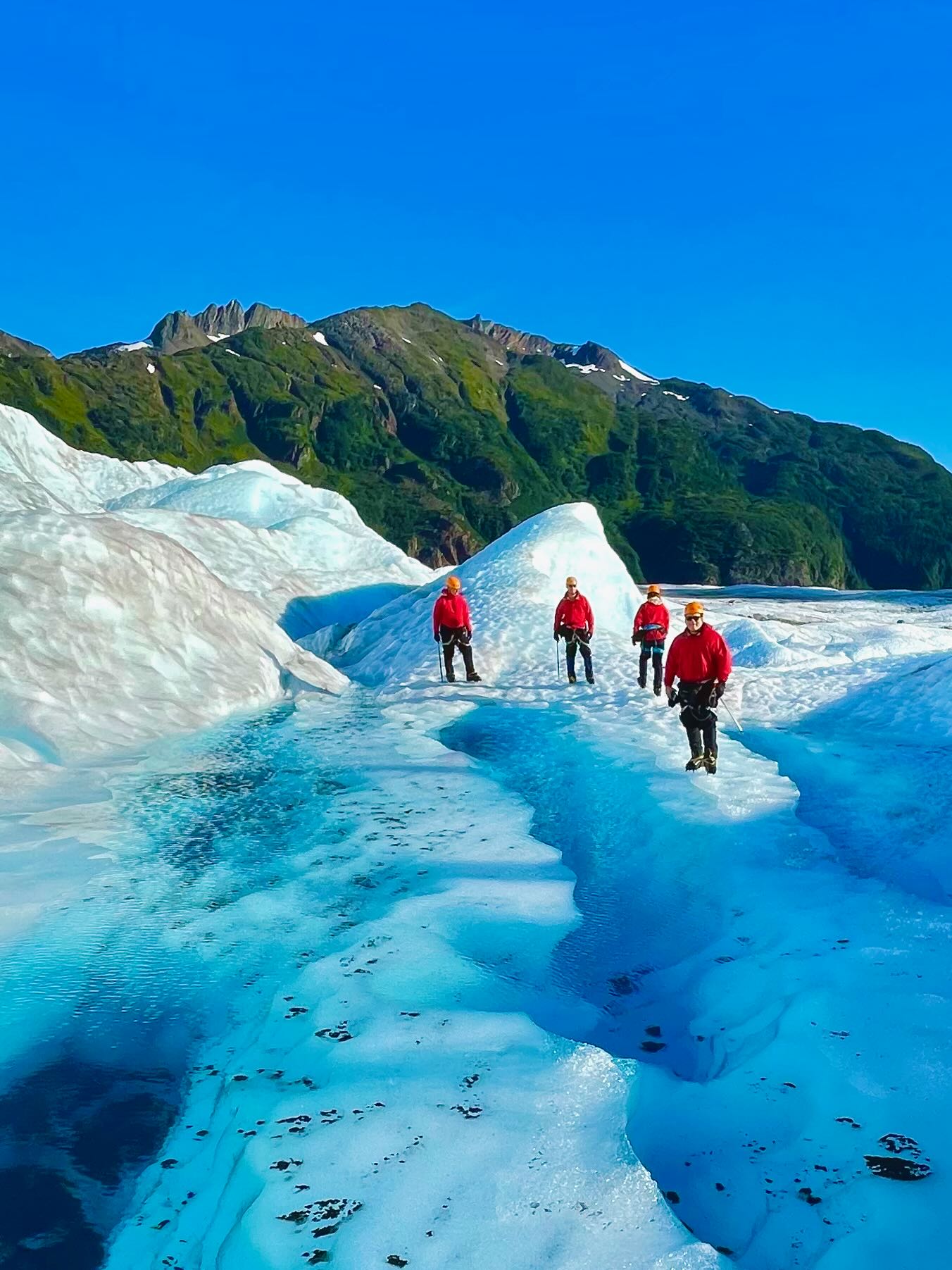 Ship lifeboat arm framing fjord and mountains