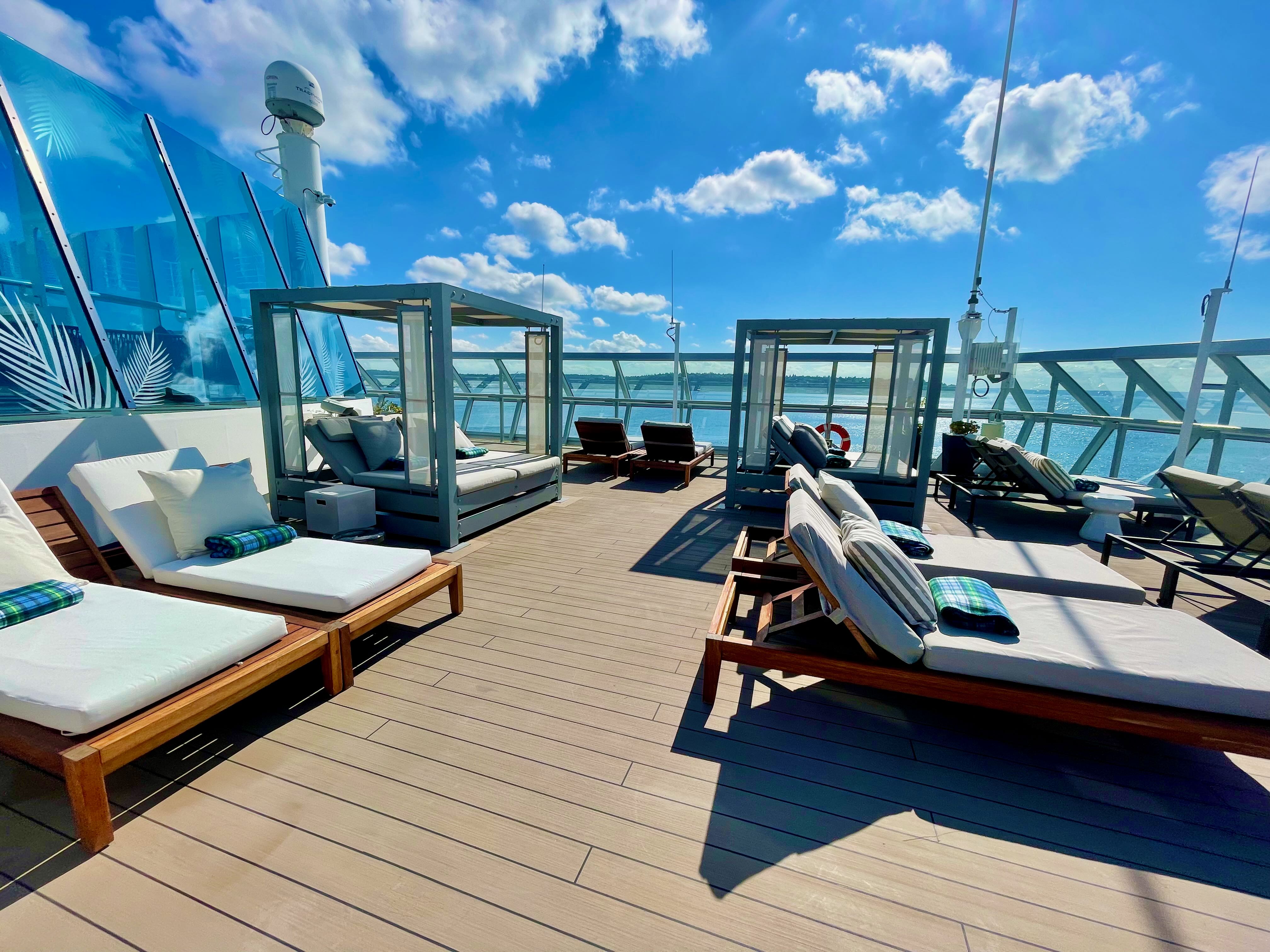 Retreat deck cabana daybeds under blue sky