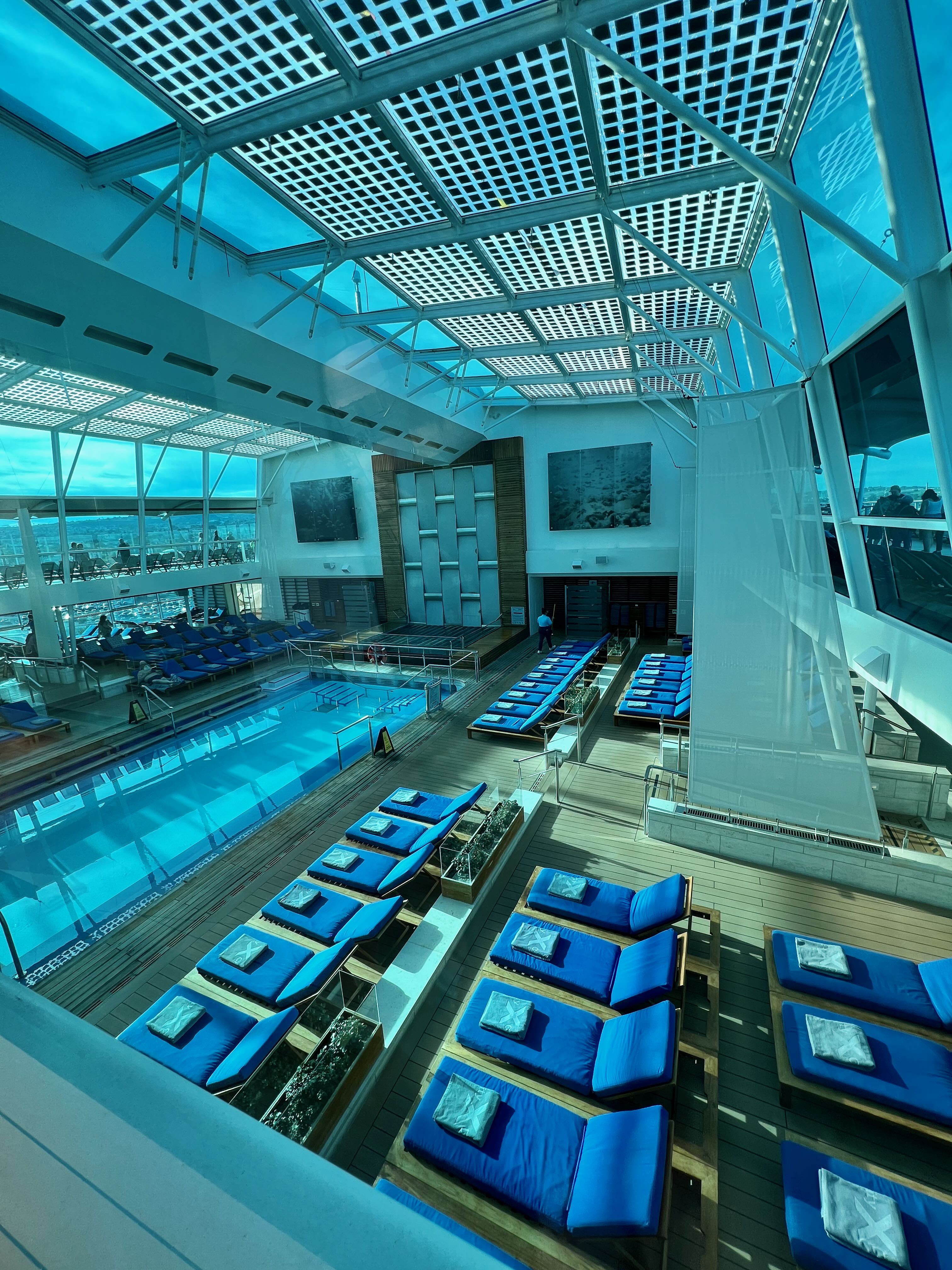 Patrick small against massive glacial ice wall