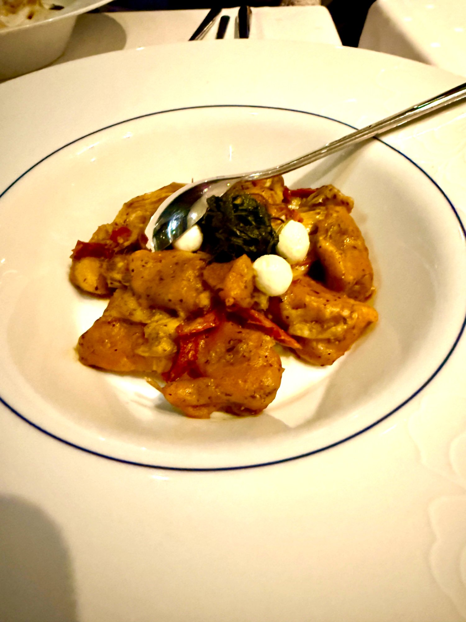 Blu strip steak with mashed potato, vegetables, and crispy onions