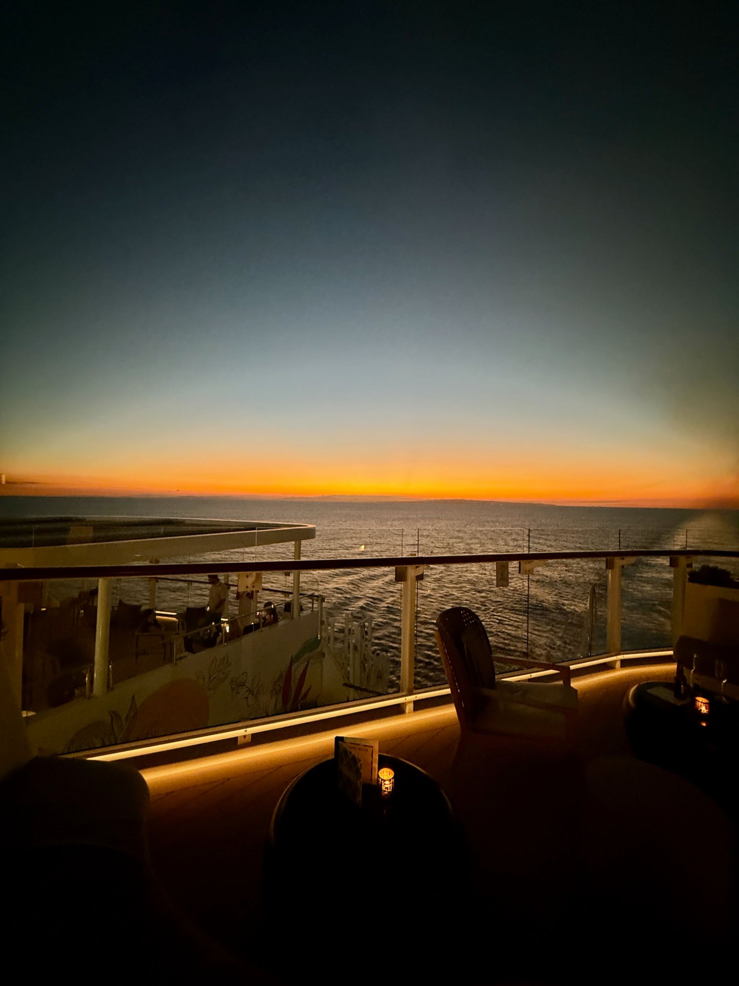Fiery orange sunset from the Celebrity Xcel bar deck
