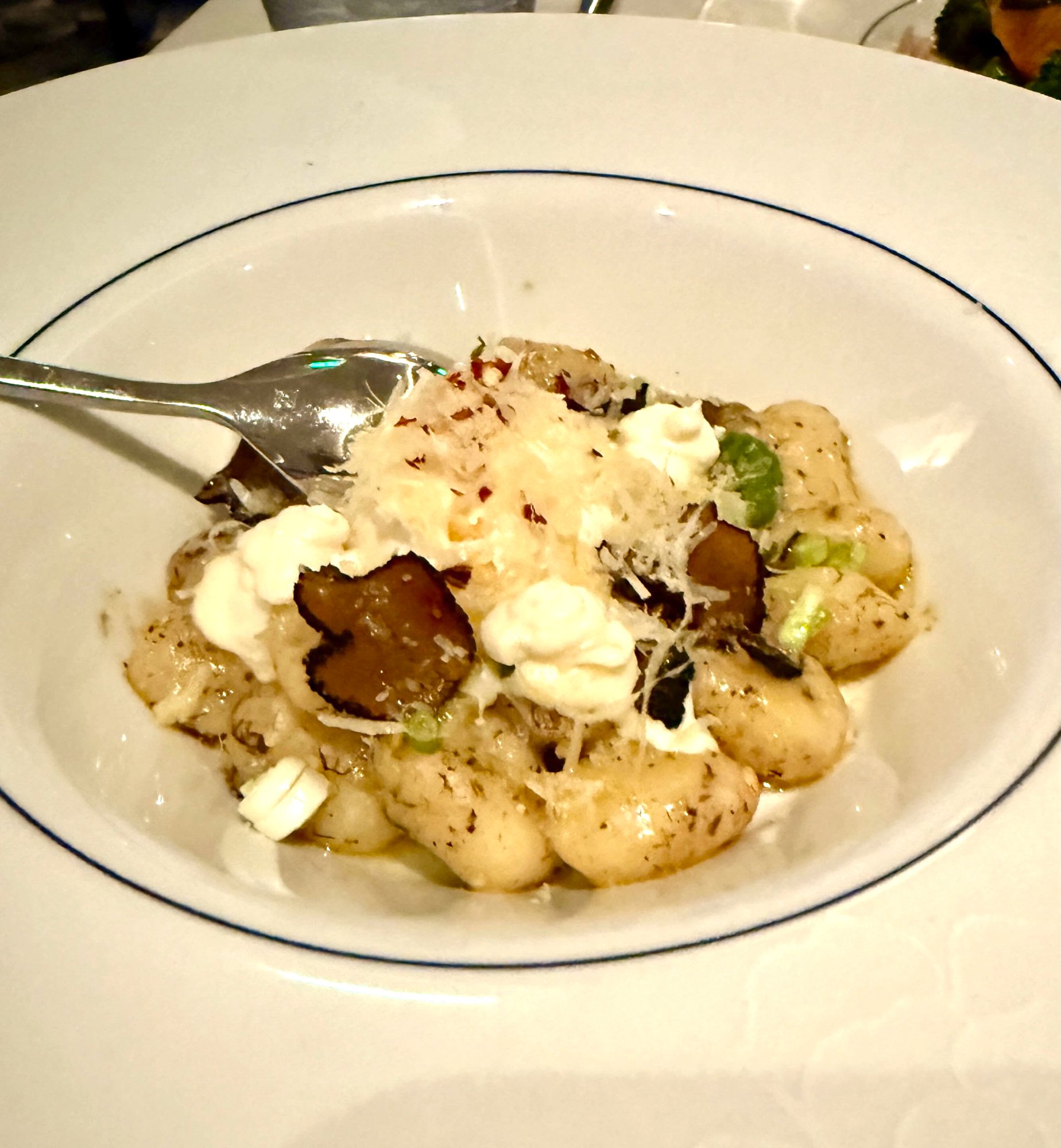 Blu truffle gnocchi with burrata and black truffle shavings