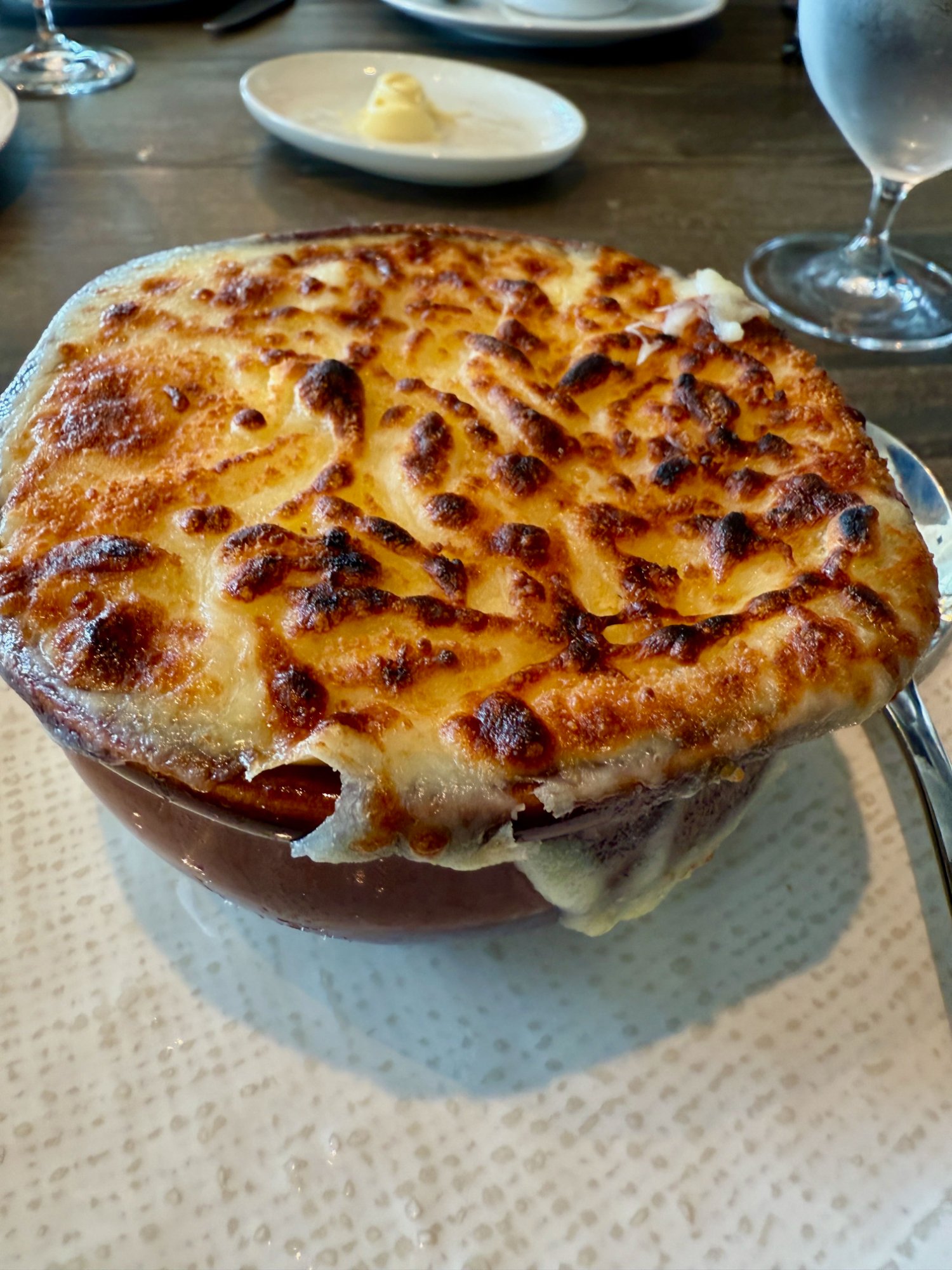 Le Grand Bistro French Onion Soup with deeply broiled gruyère crust