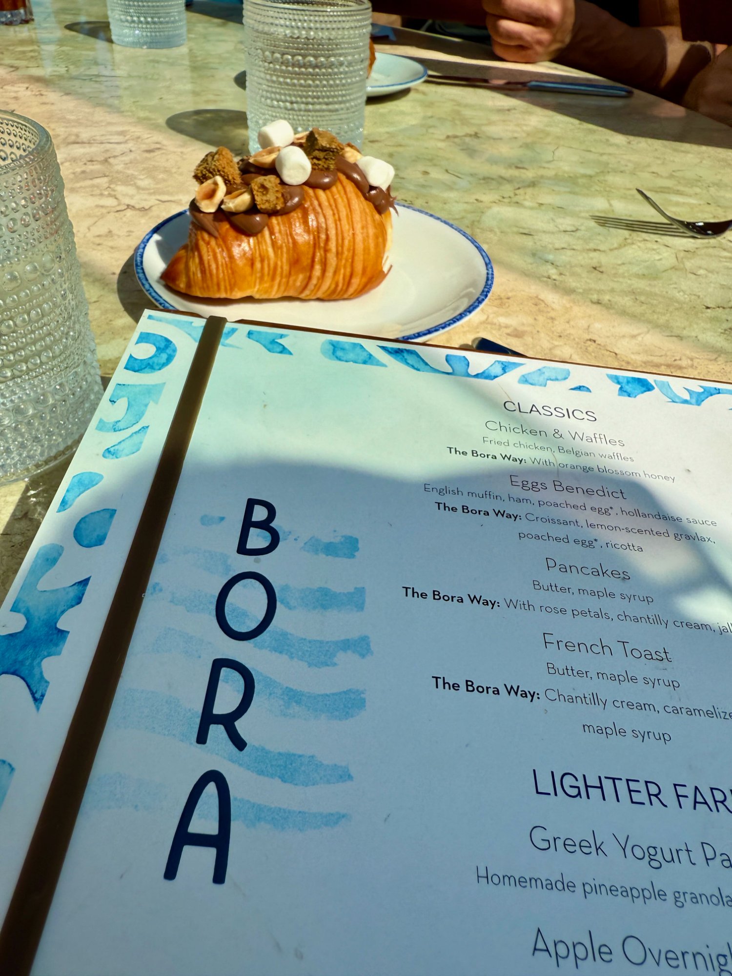 Bora brunch menu with chocolate croissant