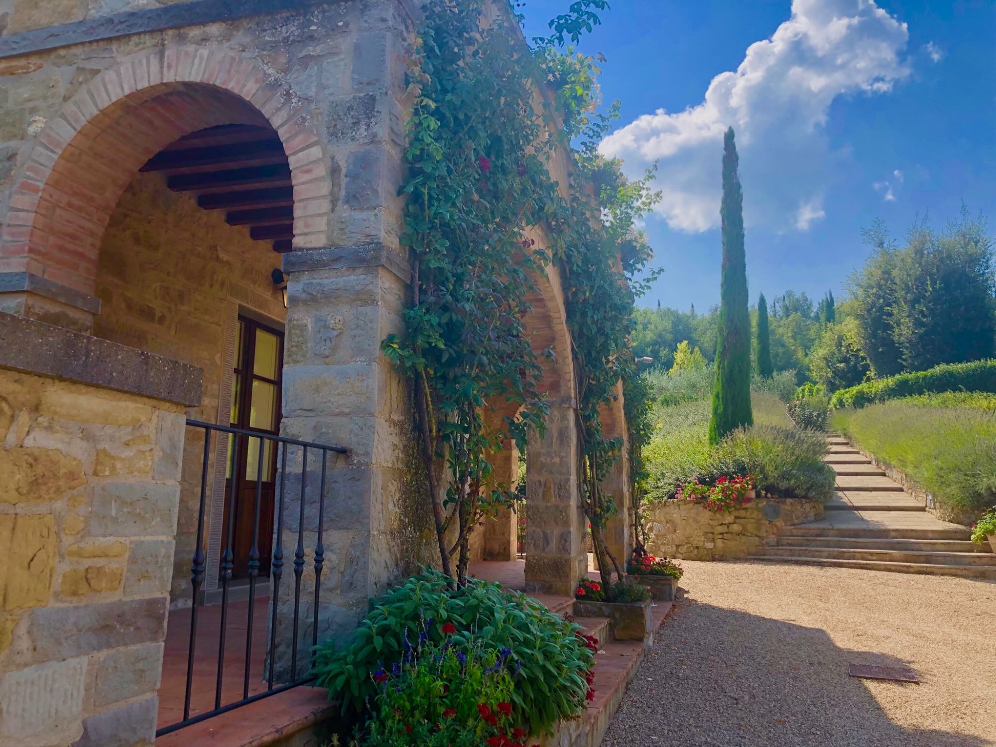 Casa Portagioia grounds — stone archway and gardens