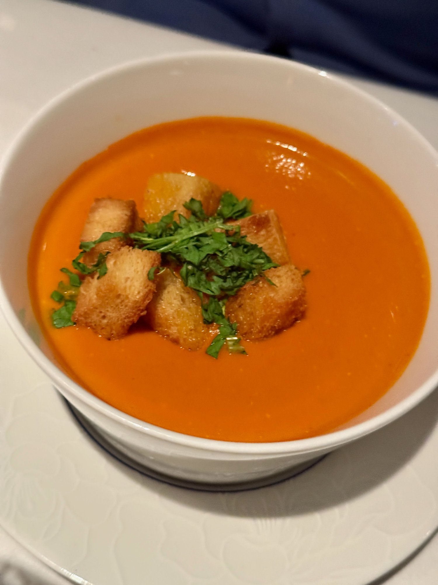 Blu tomato bisque with croutons and fresh herbs