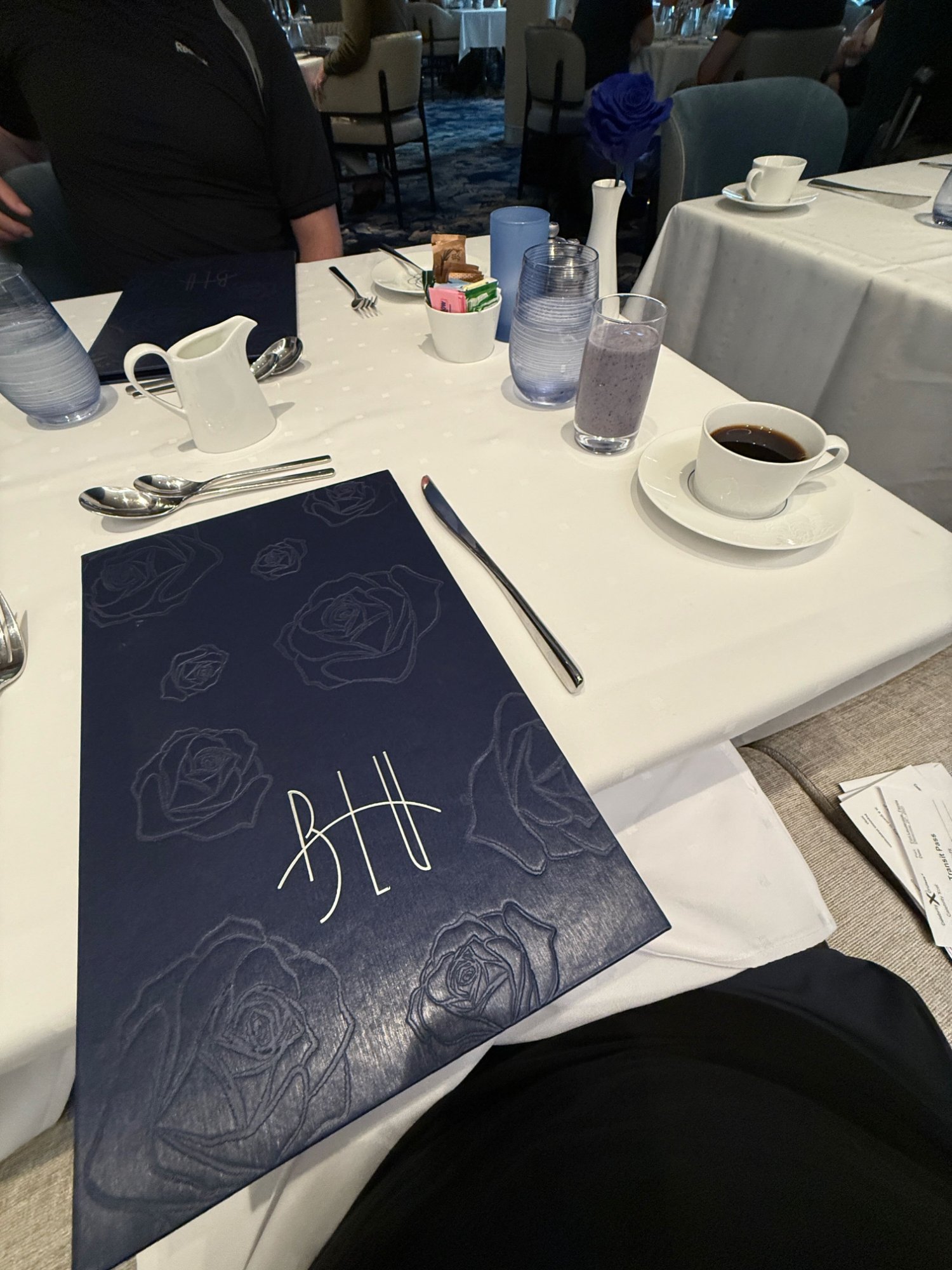 Blu restaurant — the cobalt blue rose centerpiece with dining room behind