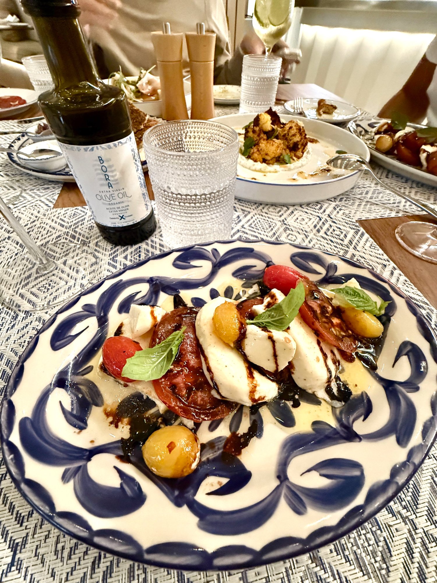 Bora dinner heirloom caprese with burrata and Bora olive oil