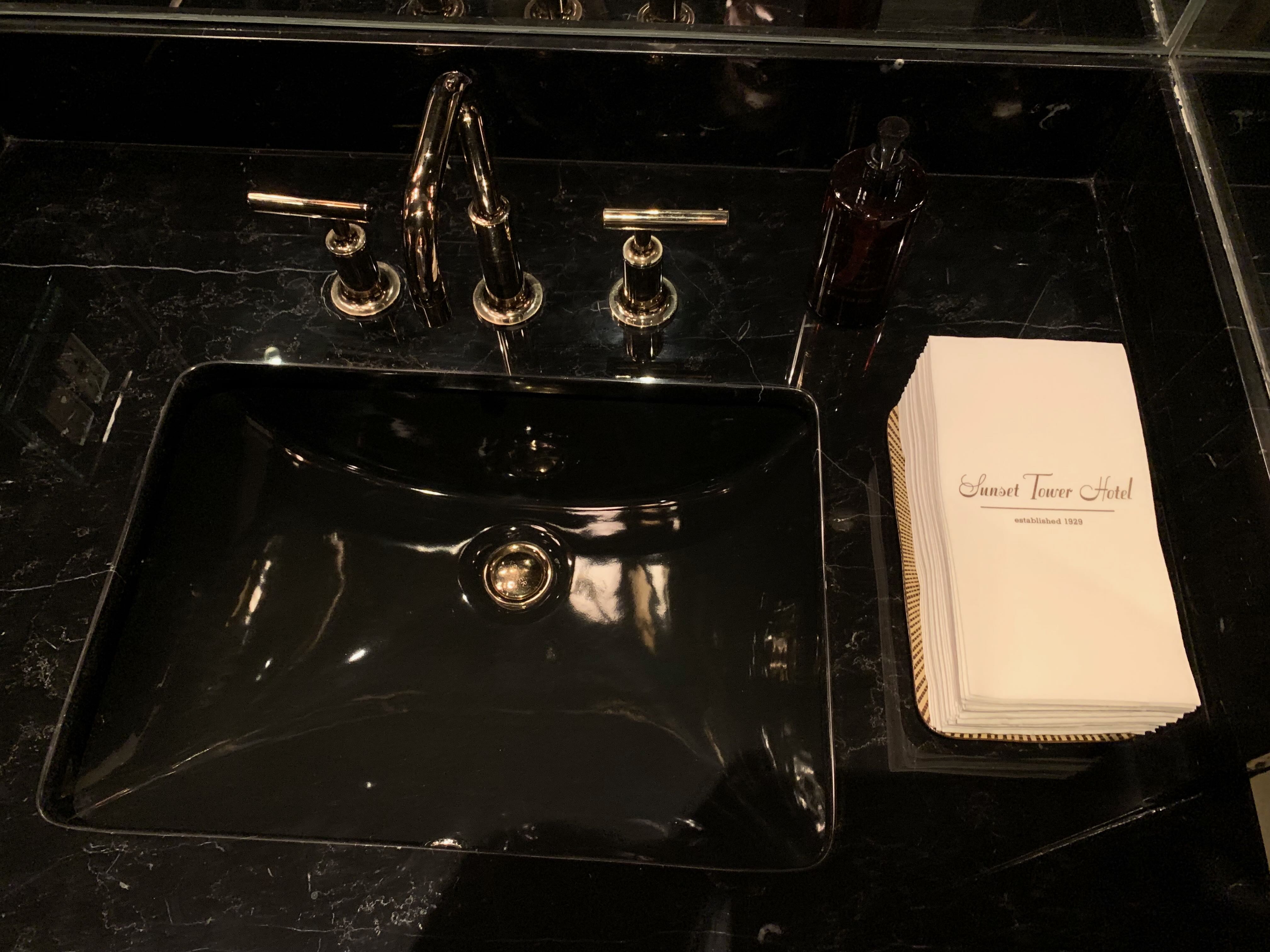 Specially embossed disposable plush hand towels in every lavatory — Sunset Tower Hotel