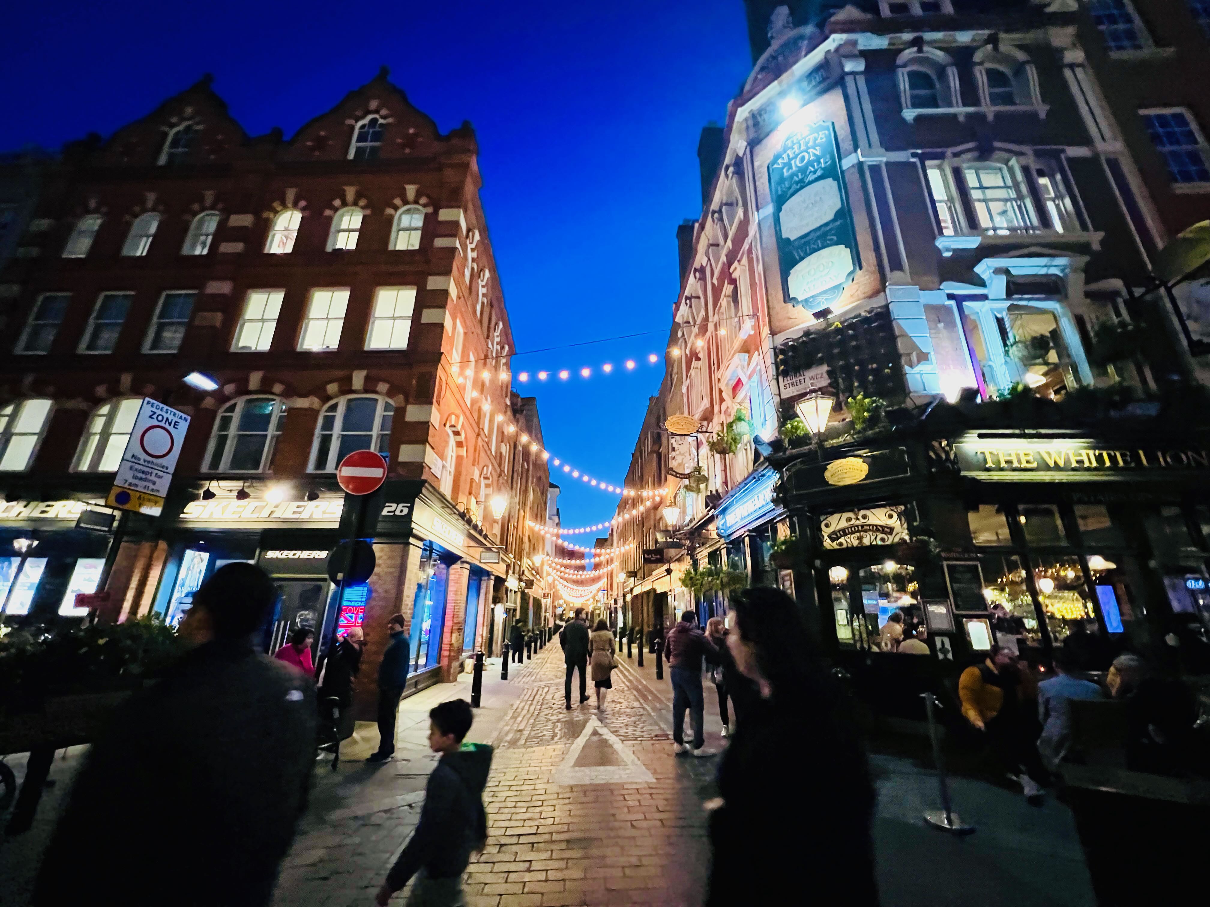 Dramatic night pub scene — Covent Garden area, London