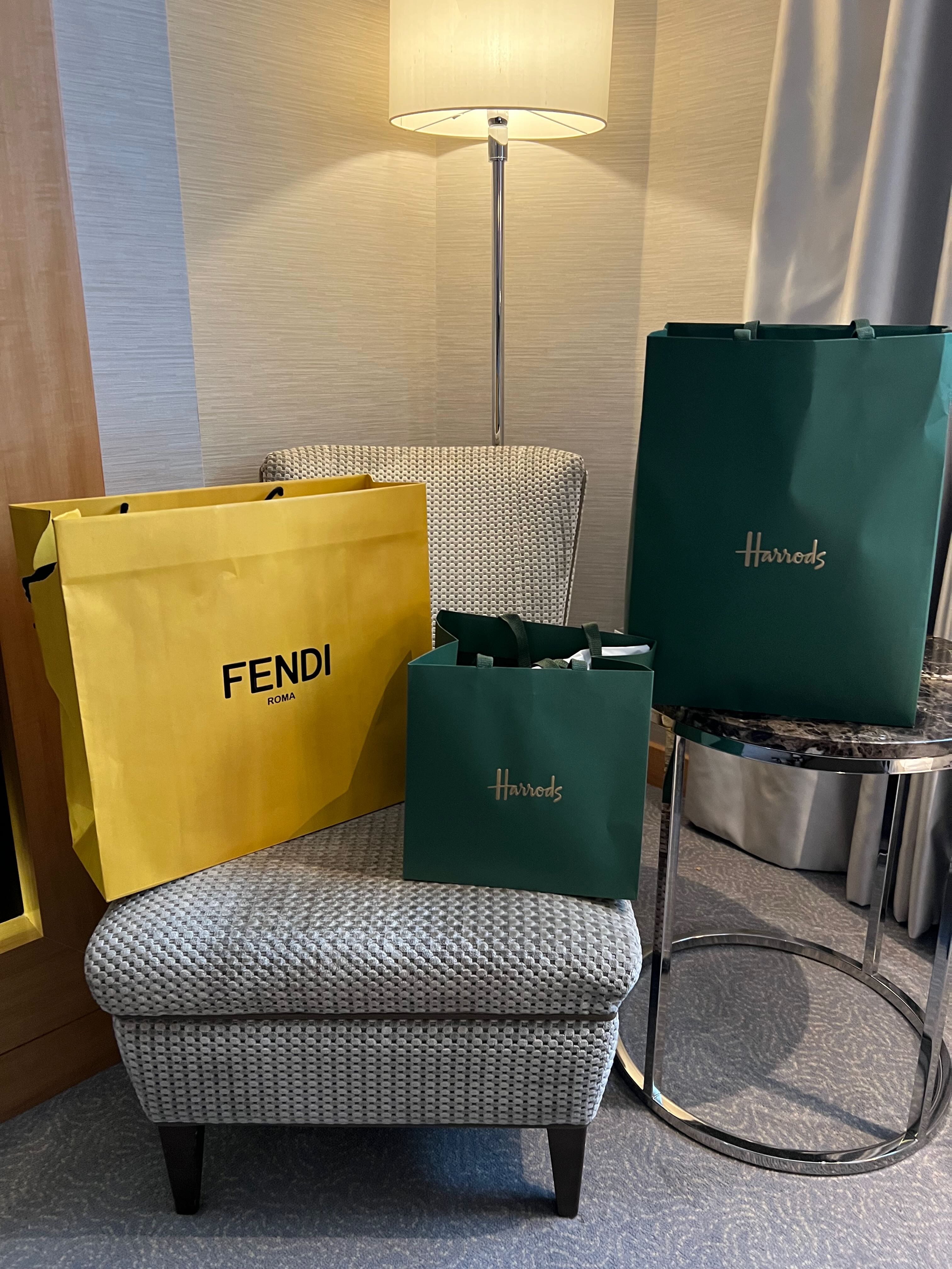 Harrods shopping bags in the Conrad St James guest room — London