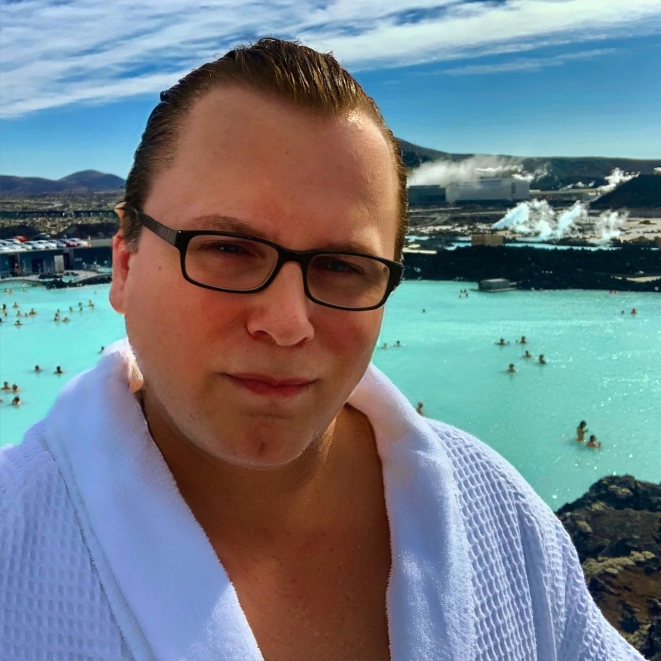 Patrick Raymond in robe at the Retreat overlook — Blue Lagoon Iceland