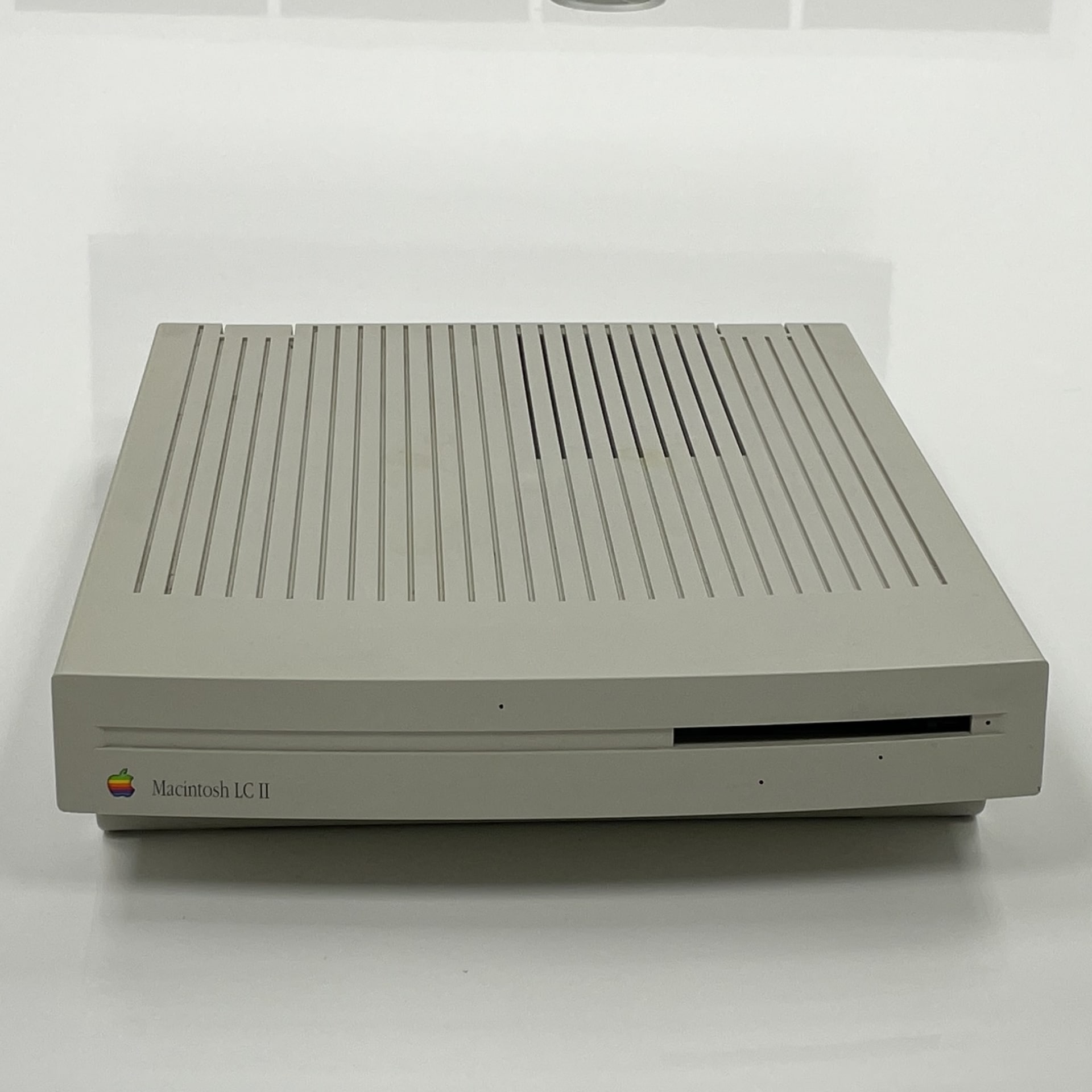The Macintosh LC II, introduced by Apple on March 23, 1992, was a compact desktop computer designed to offer enhanced performance at an affordable price point. It featured a 16 MHz Motorola 68030 processor, 4 MB of onboard RAM (expandable to 10 MB), and a 40 MB internal SCSI hard drive. The LC II was compatible with System 7.0.1 through Mac OS 7.6.1 and was discontinued on March 15, 1993