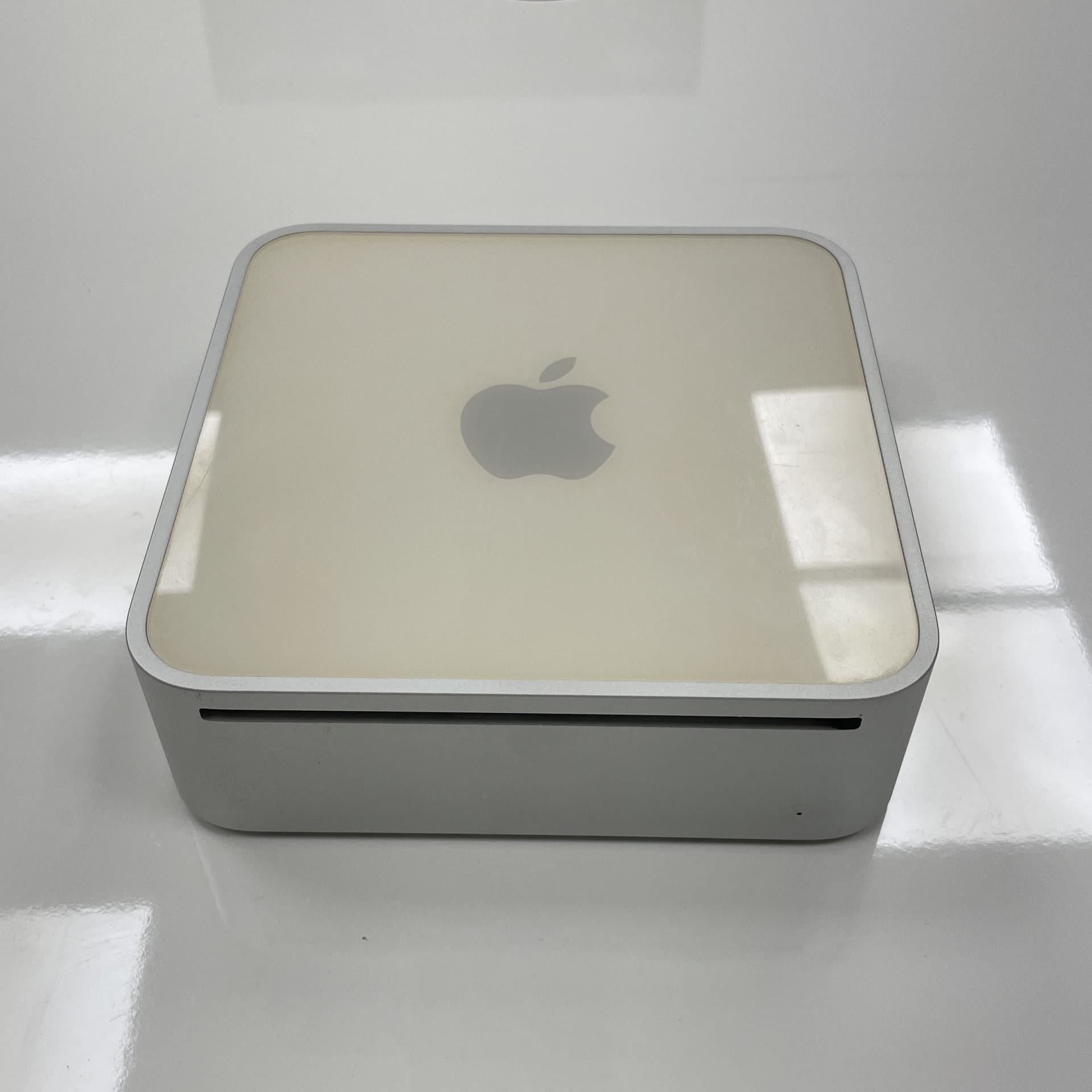 The Apple Mac mini from 2006 was Apple’s first Intel-based Mac desktop, featuring a compact design with a 1.5 GHz or 1.66 GHz Intel Core Solo or Core Duo processor, 512 MB to 1 GB of RAM, and no built-in display or keyboard, targeting users who wanted a small, affordable Mac to use with their own peripherals.