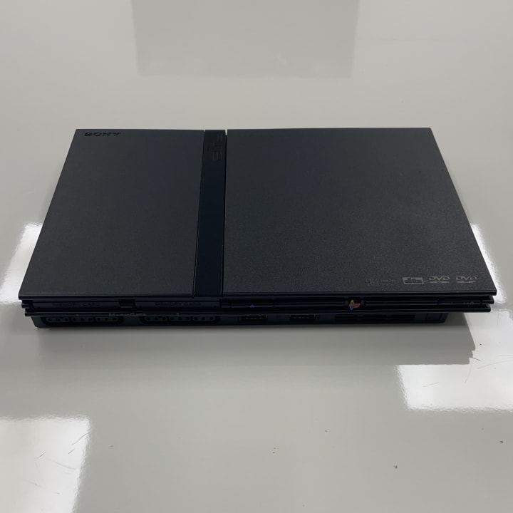 The PS2 Slim, released in 2004, is a compact and lighter redesign of the original PlayStation 2. It retained the same vast game library and DVD playback capabilities while offering a more space-efficient and energy-saving design.