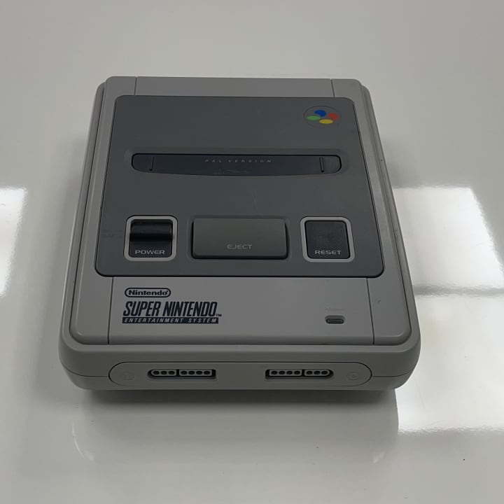The Super Nintendo Entertainment System (SNES), released in the early 1990s, is a 16-bit console known for its rich graphics, memorable soundtracks, and classic games like Super Mario World and The Legend of Zelda: A Link to the Past. It played a key role in popularizing console gaming with its diverse and high-quality game library.