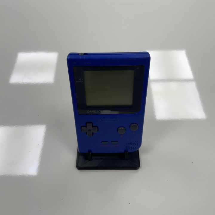 The Game Boy Pocket, released by Nintendo in 1996, is a smaller, lighter, and more portable version of the original Game Boy. It featured a clearer black-and-white screen and improved battery life, making handheld gaming more convenient and accessible.