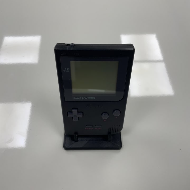 The Game Boy Pocket, released by Nintendo in 1996, is a smaller, lighter, and more portable version of the original Game Boy. It featured a clearer black-and-white screen and improved battery life, making handheld gaming more convenient and accessible.