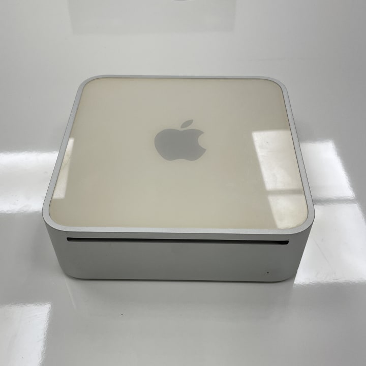 The Apple Mac mini from 2006 was Apple’s first Intel-based Mac desktop, featuring a compact design with a 1.5 GHz or 1.66 GHz Intel Core Solo or Core Duo processor, 512 MB to 1 GB of RAM, and no built-in display or keyboard, targeting users who wanted a small, affordable Mac to use with their own peripherals.