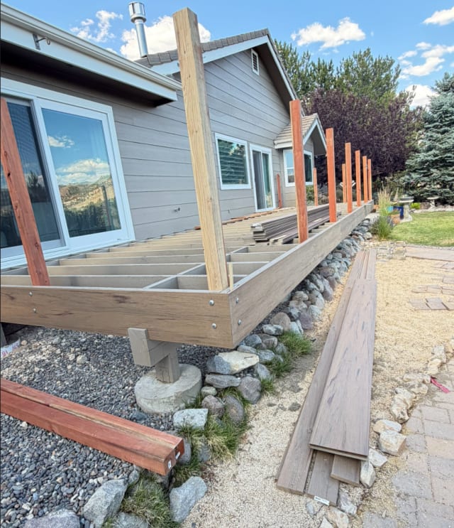Exterior of a home with a wood deck from one of our projects