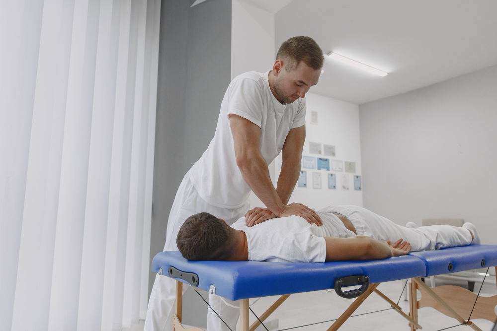 Chiropractor with a patient