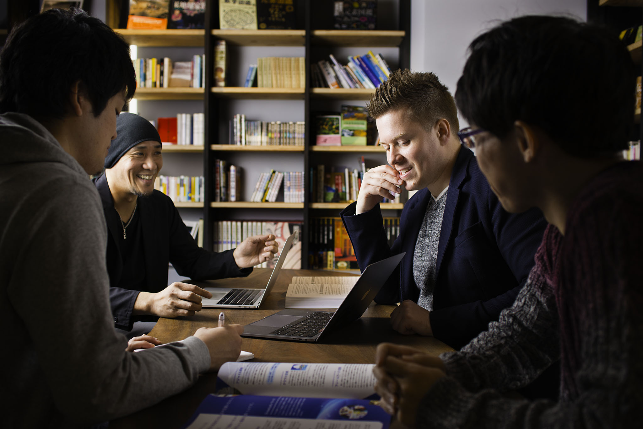Photo of Co-workers at a Desk
