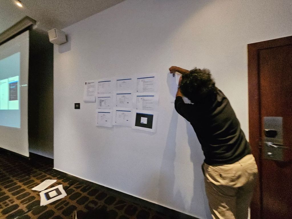 Teams generating sticky notes and mapping ideal contribution workflows