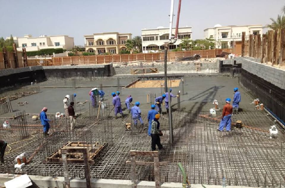 Rotary piling rig and Hitachi crawler crane working on a basement and foundation project in a Dubai villa community