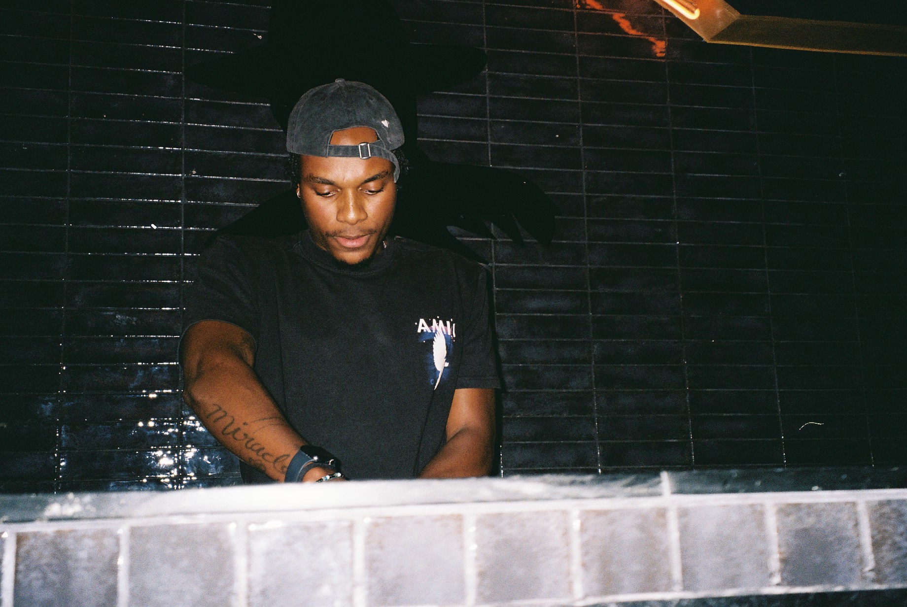 Challenge preparing a set with turntables in a dimly lit booth.
